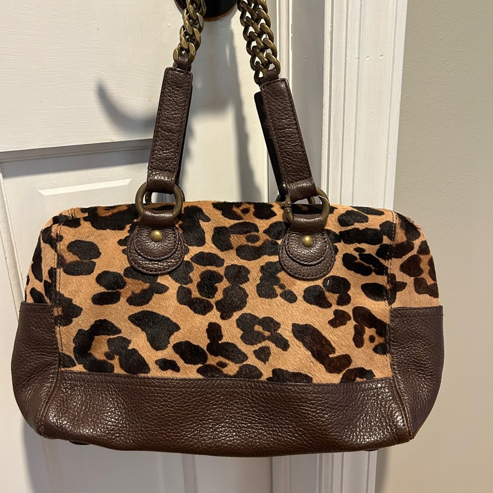 Leopard print and leather hand bag with chain handle.